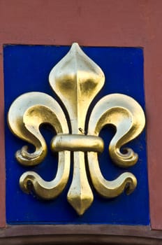 golden fleur de lis on a facade