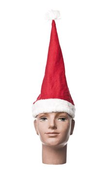 Santa claus hat on a doll isolated on a white background