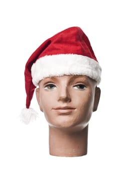 Santa claus hat on a doll isolated on a white background