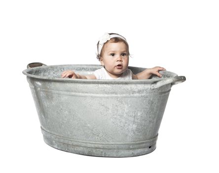 Baby in a bucket isolated on white