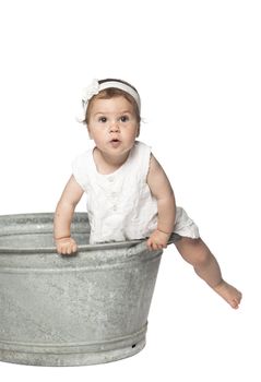 Baby in a bucket isolated on white