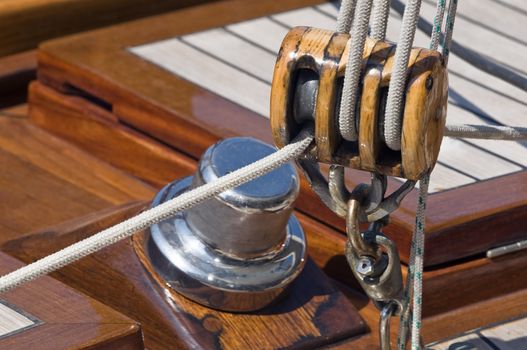 Close-up of sailing block of a wooden yacht