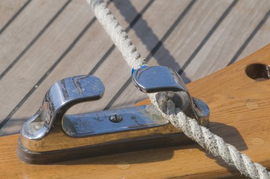 Close-up of rope fairlead on a wooden boat