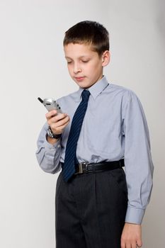 young boy talking by cell phone