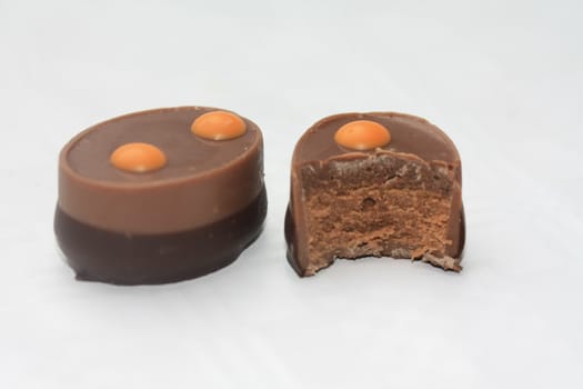 Belgium chocolate praline with an orange decoration