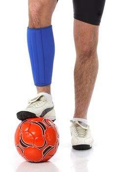 Soccer player wearing a neoprene brace, over white