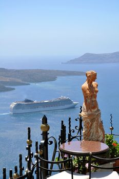 View of a cruise ship departing Santorini, in the Mediterranean Sea. Greece.