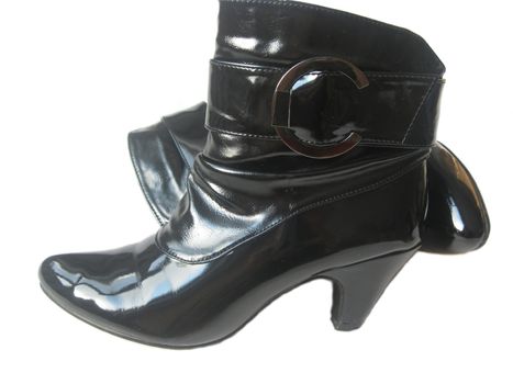 Female autumn half boots of black colour with an average heel