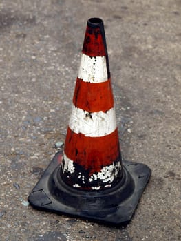 Traffic cone for road works with red and white stripes