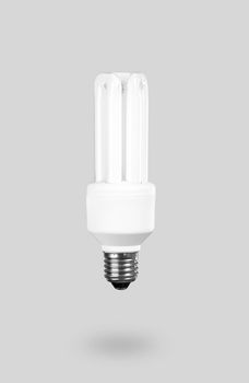 Fluorescent Light Bulb on a gray background � energy concept