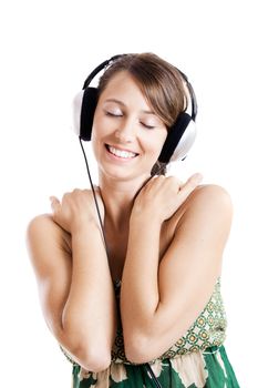 Beautiful young woman listen music with headphones, isolated on white