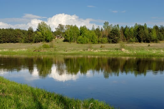 Cloud in the sky over the river Vilija in the spring afternoon.