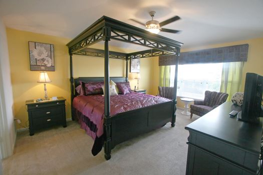 An Interior Home shot of a King Master Bedroom