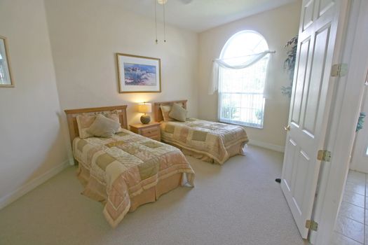 An Interior Home shot of a Twin Bedroom