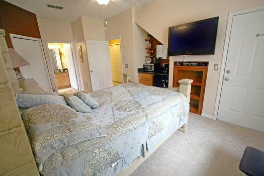 An Interior Home shot of a Queen Master Bedroom