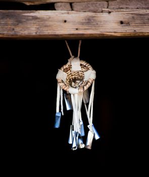 Native American Dream Catcher Suspended from Wooden Beam
