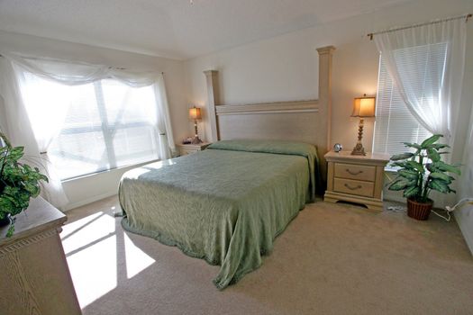 An Interior Home shot of a King Master Bedroom