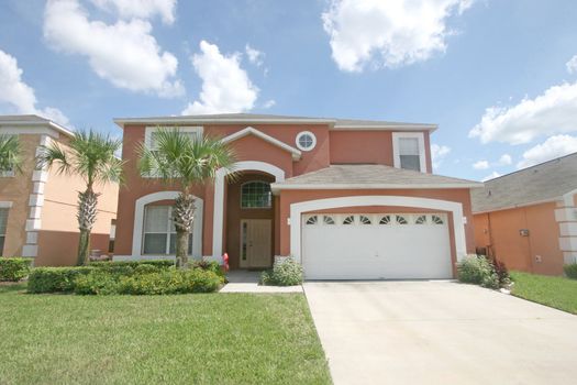 A front exterior of a large florida home