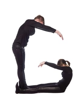 The letter 'G' formed by people dressed in black
