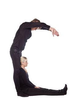 The letter 'C' formed by people dressed in black