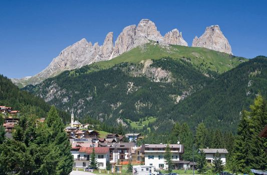 panorama of Alba di Canazei and Fassa valley with Sassolungo mount (Langkofel) behind. Photo taken with polarizer filter