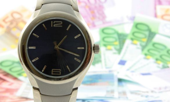 Watch with money on the background