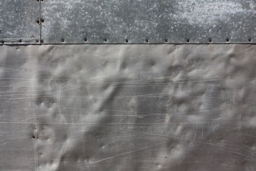 Wall of aluminum and tin punched with nails and covered with oxide