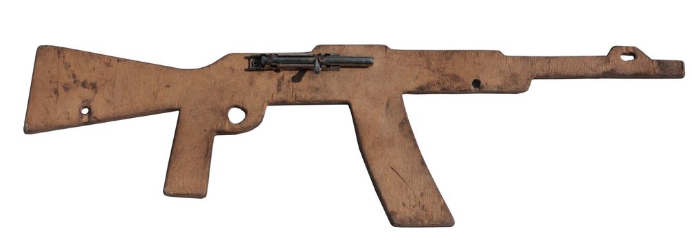 wooden model of a toy automatic rifle