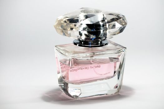 picture of small bottle with perfumes on a white background