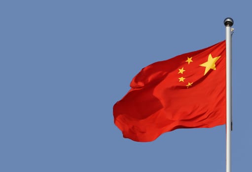 Chinese flag on blue sky background