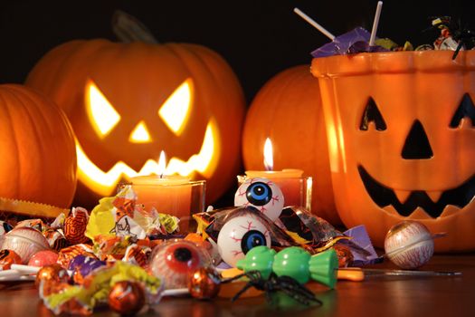 Closeup of candies with pumpkins after Halloween festivities