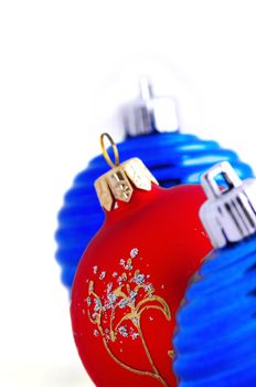 blue christmas balls and one red christmas ball