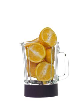 Blender with oranges isolated on white background