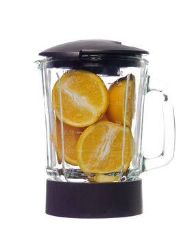 Blender with oranges isolated on white background
