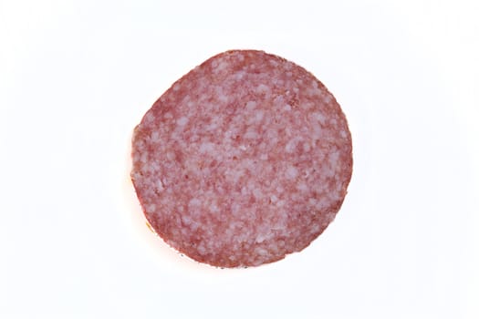 Macro picture of slice of salami isolated on white background