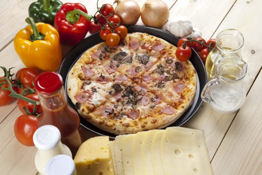 A couple of delicious pizzas, with raw tomatoes, green peppers and mushrooms