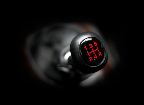 Closeup of a car 5 speed gearstick.