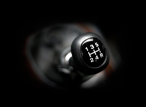 Closeup of a car 5 speed gearstick.