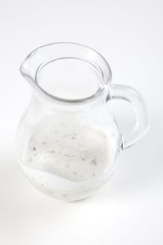 Small sause in glass on white background