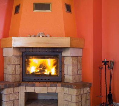 red fireplace with a small hell inside