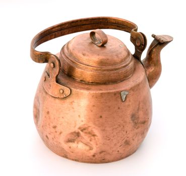 Ancient copper teapot a close up on a white background.