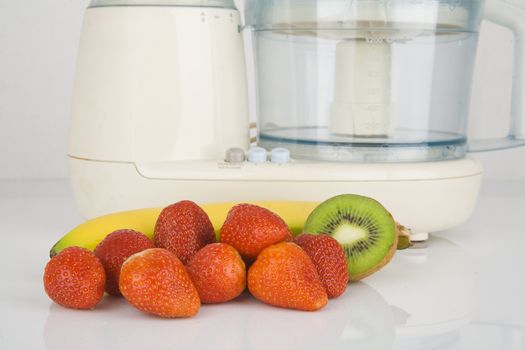 fresh fruits ready to chop in electric mixer