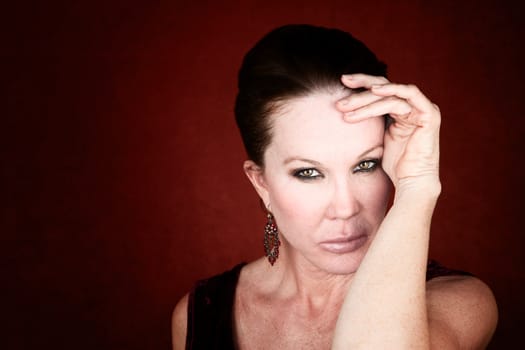 Beautiful  Mid Adult Woman on a Red Background