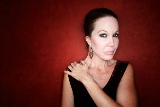 Beautiful  Mid Adult Woman on a Red Background