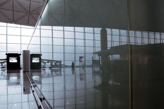 It is a morning scene from the glass reflection in the airport.