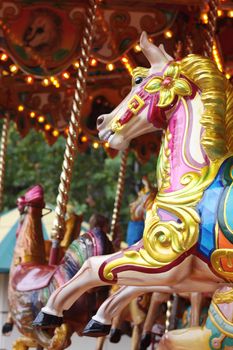 Detail of a horses head from a carousel ride at a fairground.