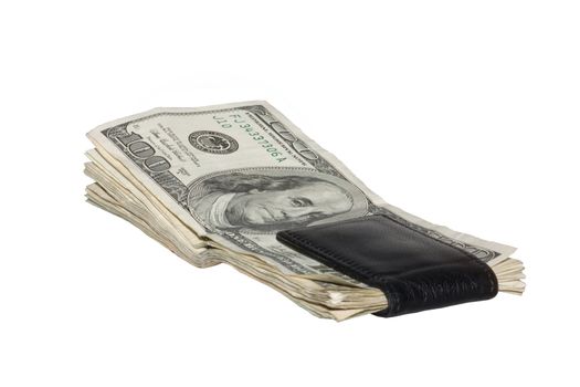 US One hundred dollar bills in black money clip. The money is faded and worn. 