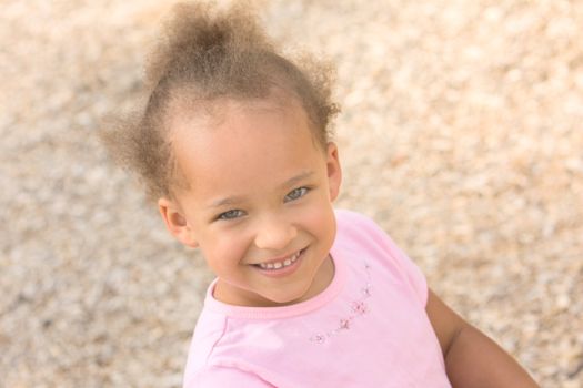 Beautiful Young Ethnic Girl wearing a pink shirt