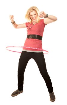 Pretty blonde girl twirling a toy hoop around her waist