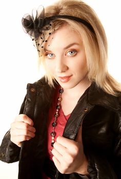Pretty young woman in a black leather jacket